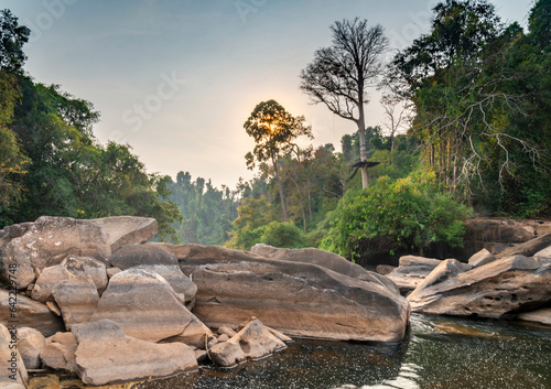 Maak Ngaew Waterfall rock pool,above cascades and rain forest, at sunset, near Pakse,Laos.