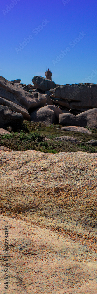 Monolithic blocks of pink granite in the Cotes d'Armor in Brittany, France. Pink granite coast Monolithic blocks of pink granite in the Cotes d'Armor in Brittany, France. Pink granite coast