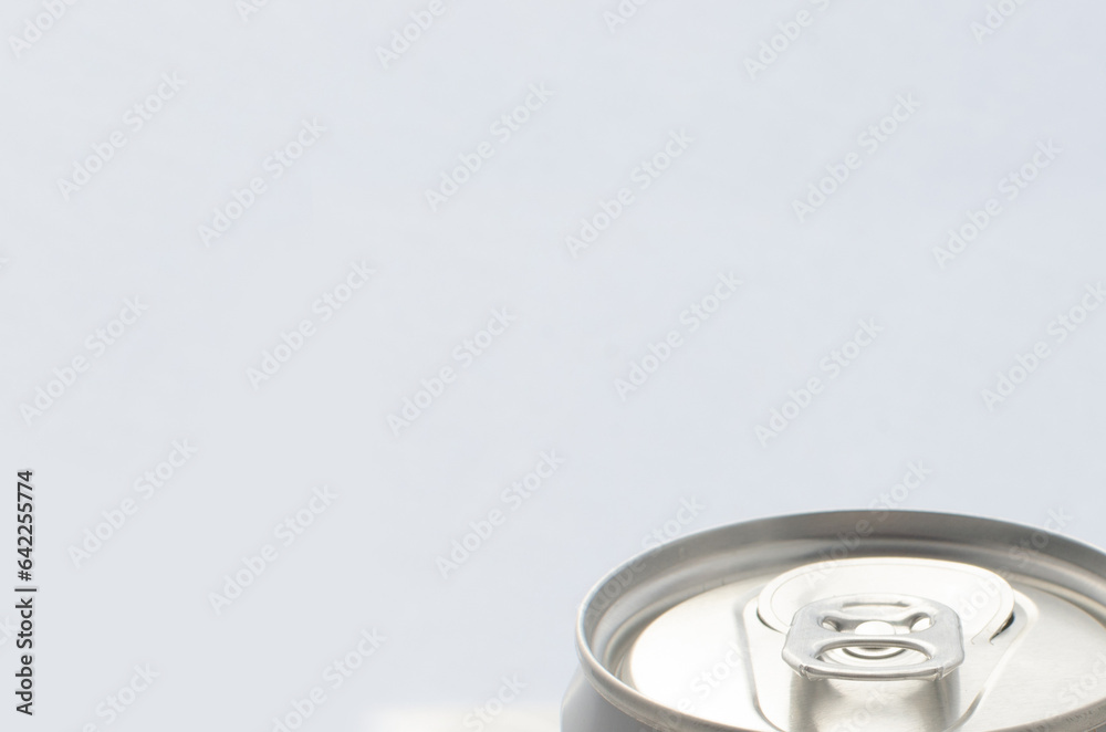 Detail of an undesigned aluminum soda can, top view.000- Glossy metallic finish and rounded edges. Detail of an undesigned aluminum soda can, top view.000- Glossy metallic finish and rounded edges.