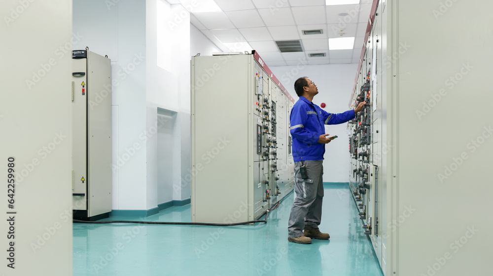 As an engineer fixes the automatic control switchboard to ensure safe operation, observe the essence of industrial technology. enhance platform visibility for microstock. As an engineer fixes the automatic control switchboard to ensure safe operation, observe the essence of industrial technology. enhance platform visibility for microstock.