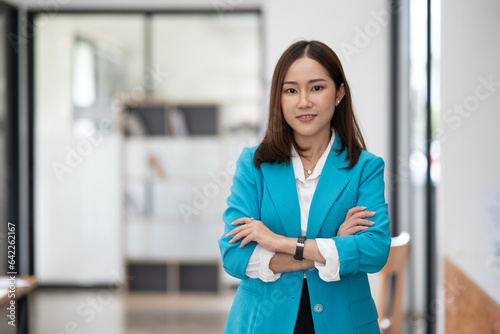  Asian businesswoman using tablet Talking about work at the office