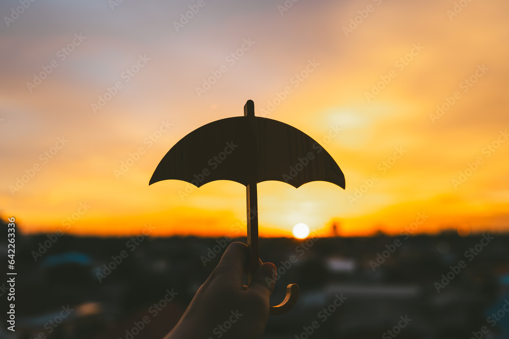 Hand of man holding an umbrella symbol. Insurance concept, Family life insurance and policy concepts	