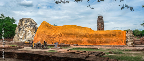 Big antique reclining buddha at Wat Lokayasutharam Temple World heritage in Ayutthaya Thailand
