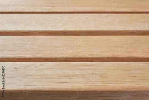 close-up of empty wooden table top, soft focus photography background or backdrop, side view of oak wood surface texture in full frame, copy space