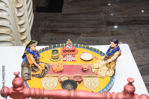 colorful clay dolls describing Tamil brahmin wedding couple on their wedding day photo