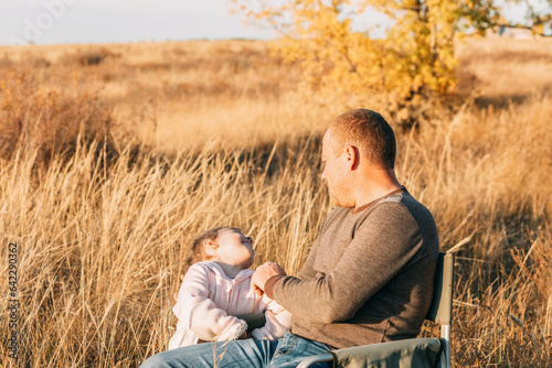 Autumn s Warm Embrace  A Young Dad and His Daughter Find Joy in a Field of Gold