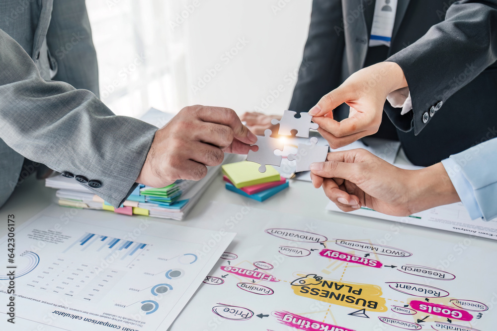 Fototapeta premium Business handshake for teamwork of business merger and acquisition,successful negotiate,hand shake,two businessman shake hand with partner to celebration partnership and business deal concept.