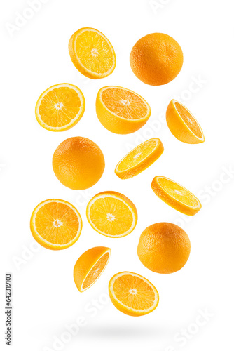 Juicy oranges as flow fly or fall as art composition. Whole, half, round slices fruit isolated on white background with shadow. Tropical fruits for advertising, design, label product, poster, card.