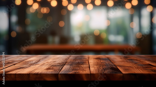 Empty wood table top on abstract blurred restaurant background