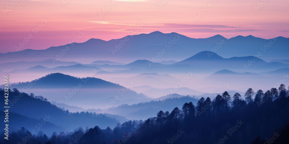 The mountains are shrouded in mist, and the last traces of daylight lend a tranquil, mystical quality to the scene. A twilight shot of autumn mountains under a fading pink and purple sky. The mountains are shrouded in mist, and the last traces of daylight lend a tranquil, mystical quality to the scene. A twilight shot of autumn mountains under a fading pink and purple sky.