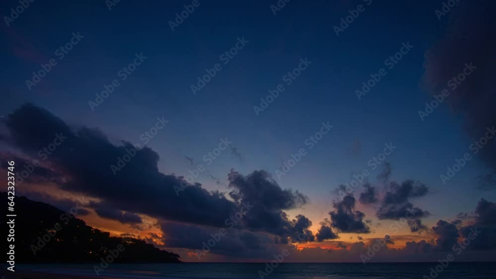Time lapse day to night dramatic sky with colorful cloudscape..amazing sunset at Karon beach. .Gradient color colorful sky in bright sunset background..Sunset with colorful light rays Gradient color Time lapse day to night dramatic sky with colorful cloudscape..amazing sunset at Karon beach. .Gradient color colorful sky in bright sunset background..Sunset with colorful light rays Gradient color