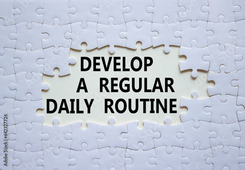 Daily routine symbol. Concept words Develop a regular daily routine on white puzzle. Beautiful white background. Business and Develop a regular daily routine concept. Copy space.