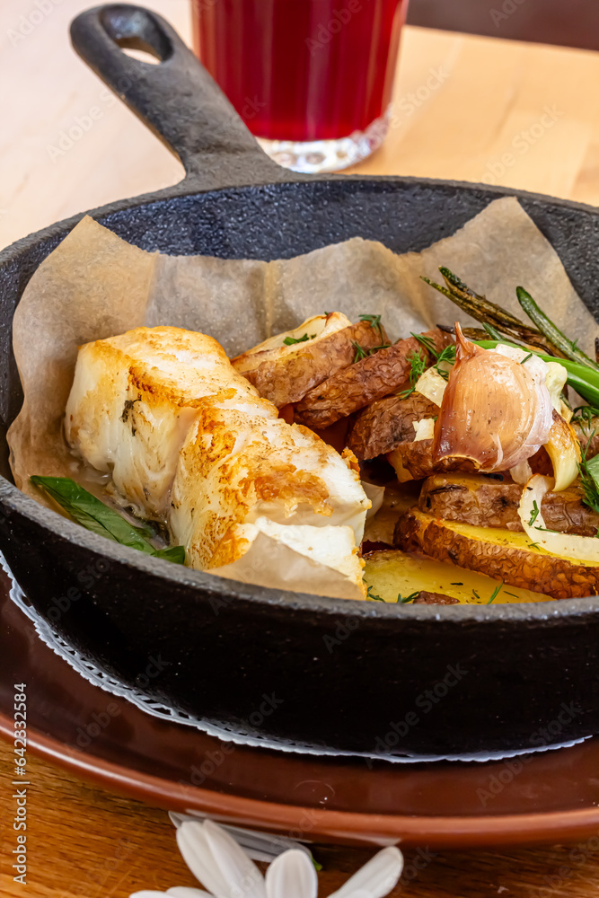 Fish dish - fried fish, fried potatoes and vegetables Fish dish - fried fish, fried potatoes and vegetables