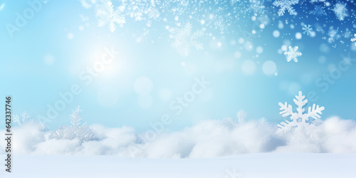 Winter snow background with snowdrifts, with beautiful light and snow flakes on the blue sky, beautiful bokeh circles, banner format, copy space © red_orange_stock