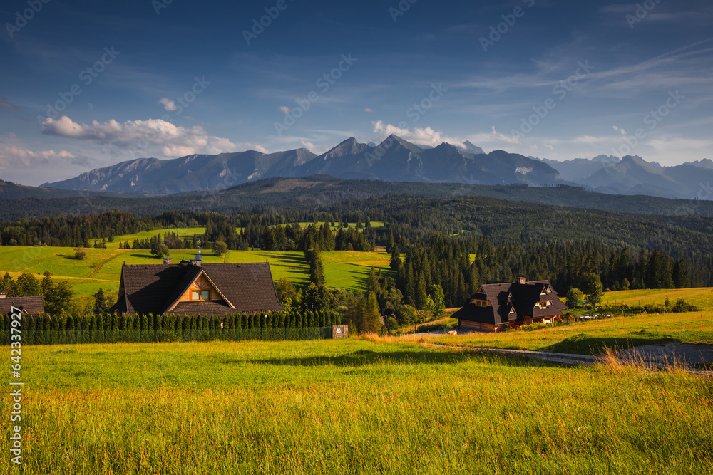 The Tatra Mountains seen from the Spiš region in Poland during a summer day. The Tatra Mountains seen from the Spiš region in Poland during a summer day.