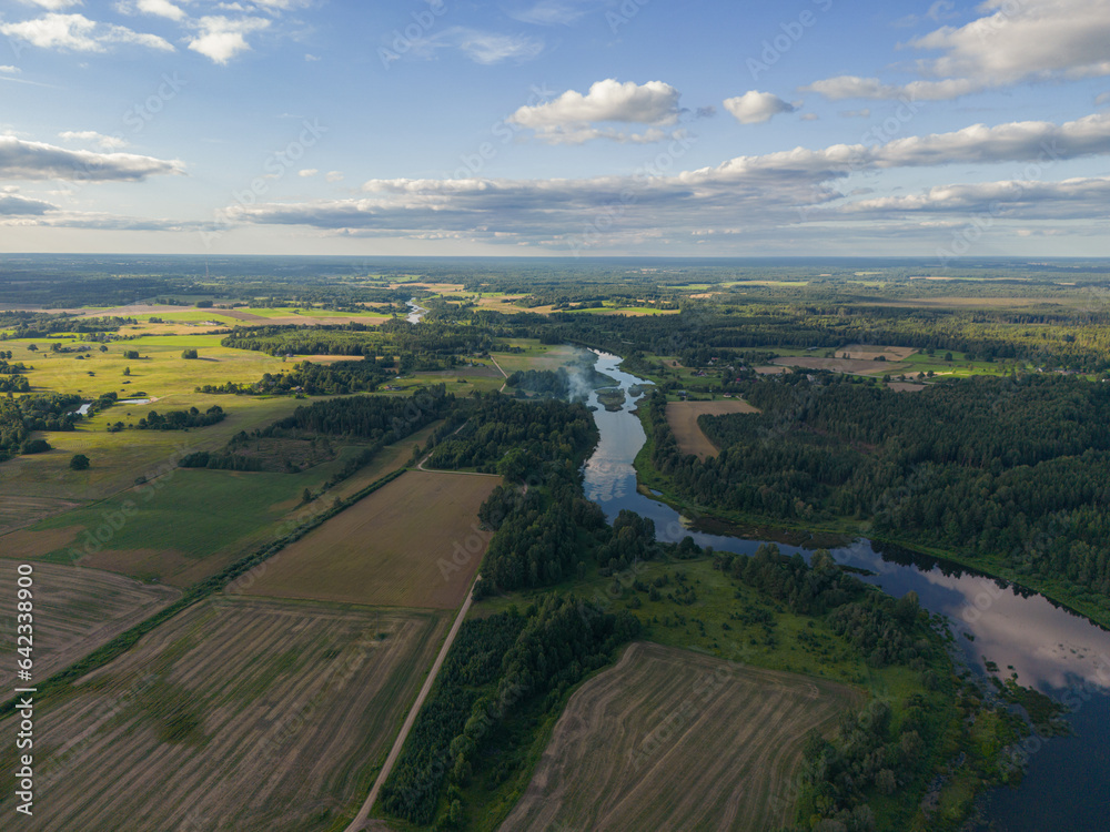 Aerial view from drone on the river and fields sunny summer day