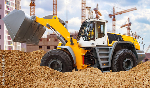 Excavator near house under ...