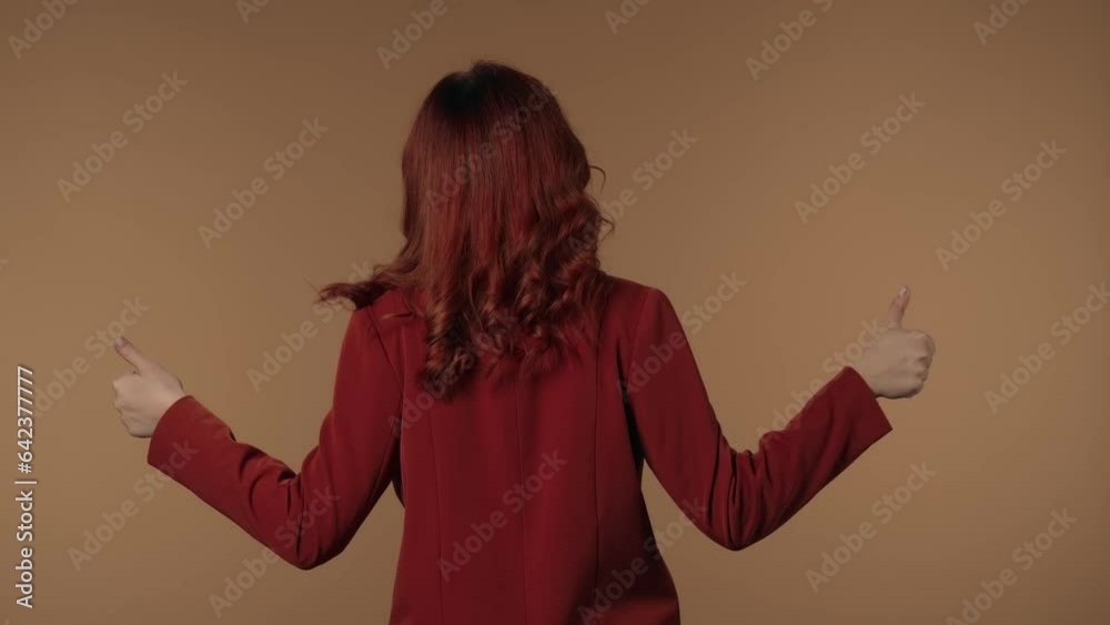 Medium isolated video of a young woman standing with her back at the ...