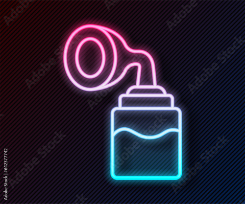Glowing neon line Breast pump icon isolated on black background. Vector