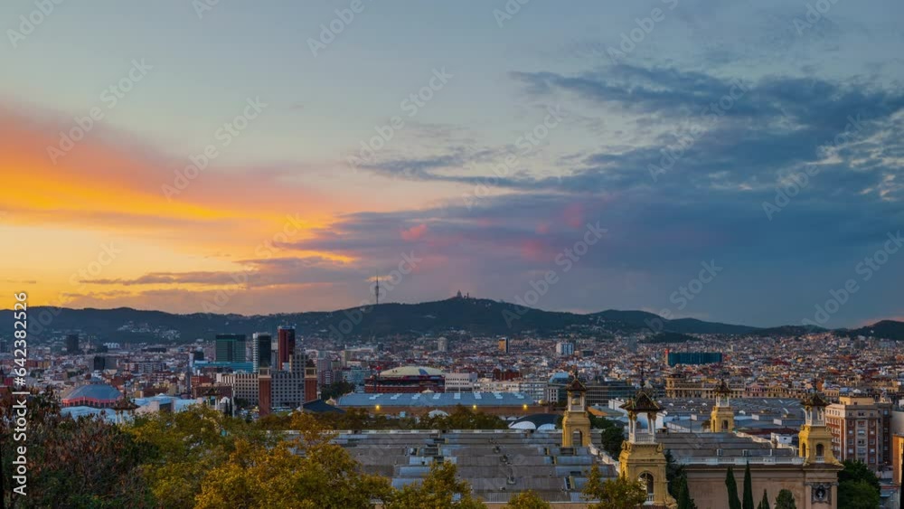 Day-to-night time lapse of the epic purple and orange clouds over Barcelona city Day-to-night time lapse of the epic purple and orange clouds over Barcelona city