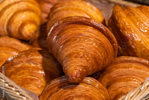 Tasty freshly baked croissants in the basket