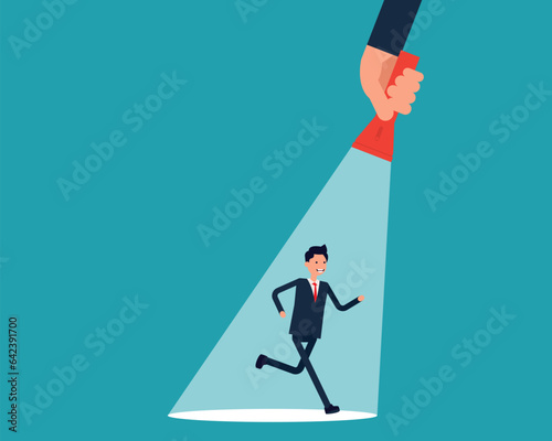 A businessman running on flashlight by hand