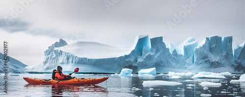 Winter kayaking in ice antartica. Frozen sea and glaciers around.