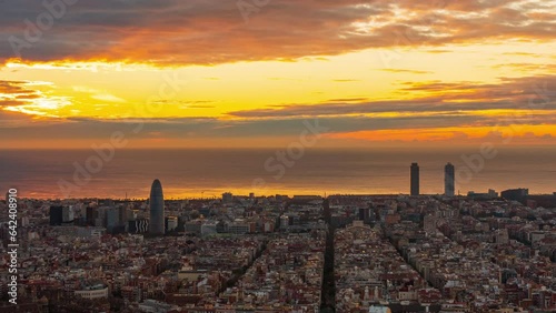 Night to day sunrising timelapse over Barcelona city skyline, Spain