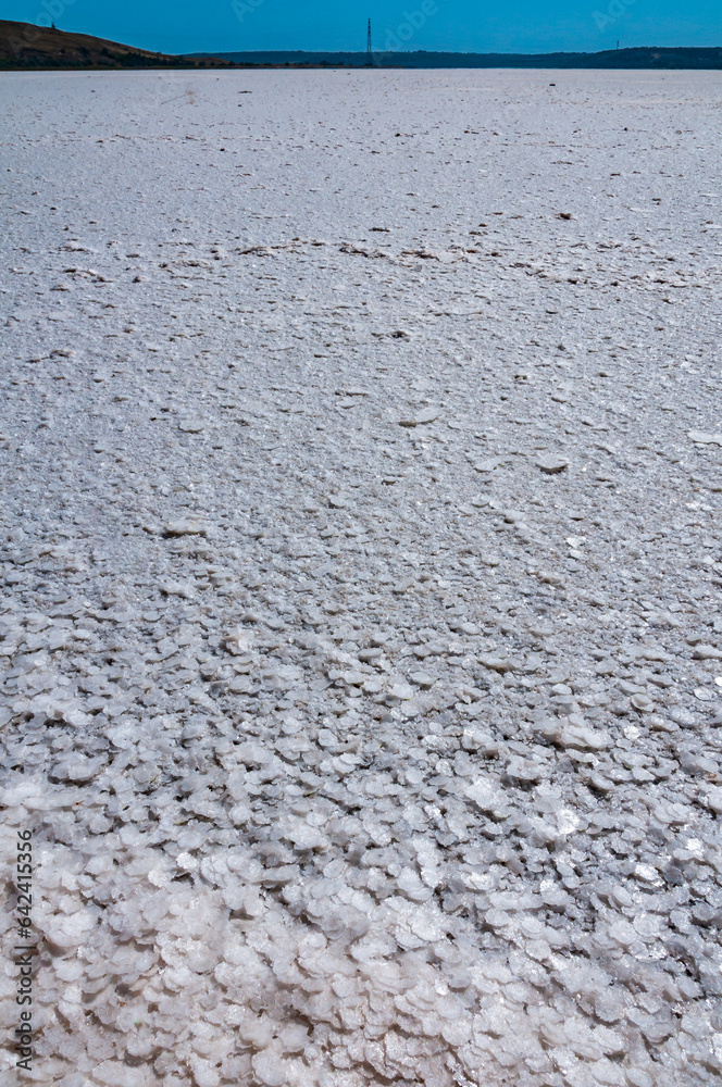 Self-precipitating table salt sodium chloride on the surface of a dried-up reservoir - Kuyalnik estuary, Odessa region, Ukraine Self-precipitating table salt sodium chloride on the surface of a dried-up reservoir - Kuyalnik estuary, Odessa region, Ukraine