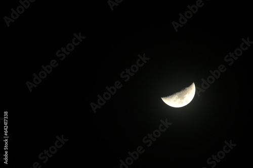 Half moon in the dark, India. photo