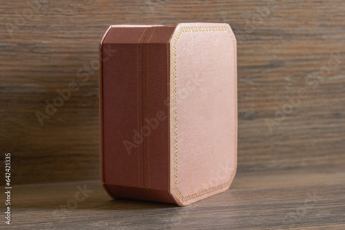Pink jewelry box on wooden background