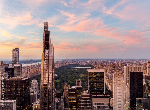 New York City skyline with Central Park at sunset from rooftop.