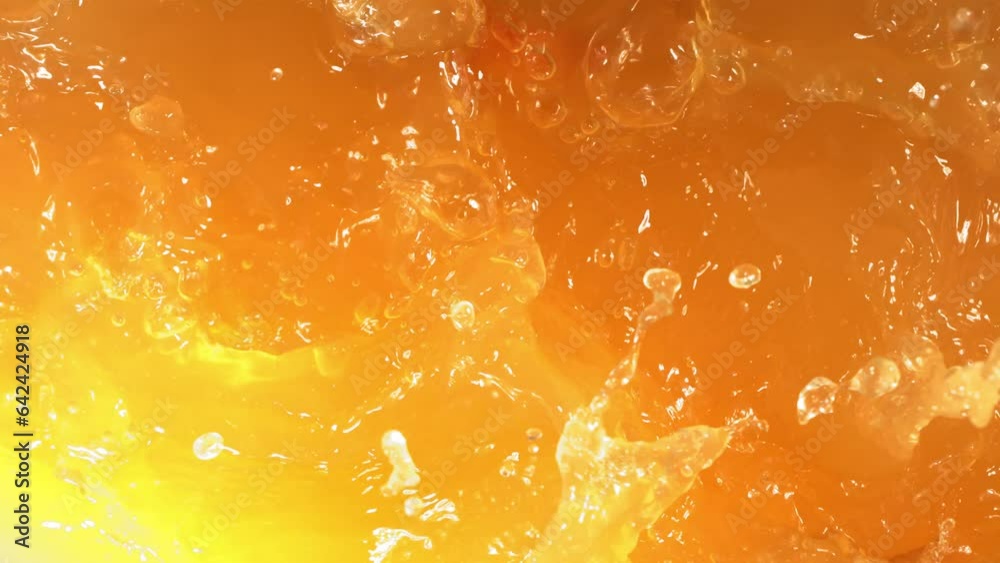Super Slow Motion Shot of Fresh Peaches Falling into Juice Whirl
