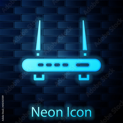 Glowing neon Router and wi-fi signal icon isolated on brick wall background. Wireless ethernet modem router. Computer technology internet. Vector