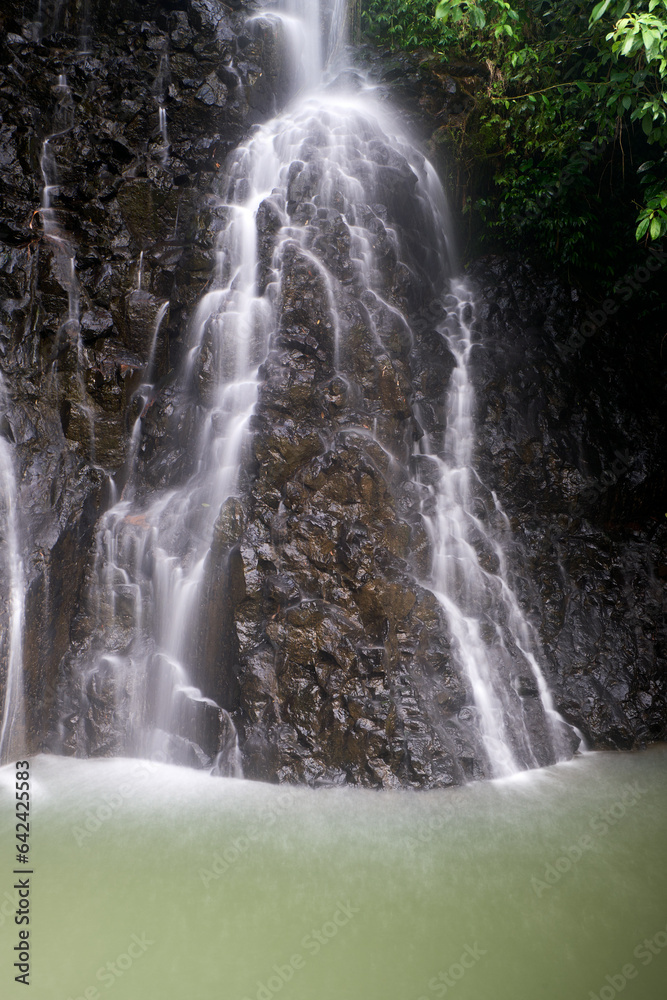 The beautiful waterfall is seen as soothing to the eyes after activities The beautiful waterfall is seen as soothing to the eyes after activities