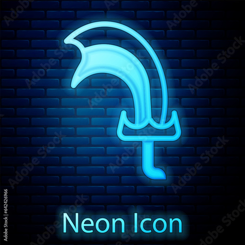 Glowing neon Sword for game icon isolated on brick wall background. Vector