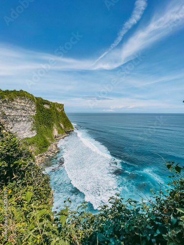 Uluwatu Temple coastline with cliffs and blue ocean