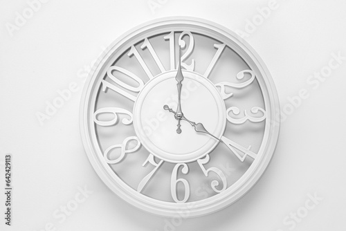 Circle clock on white background wall