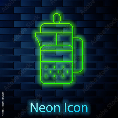 Glowing neon line French press icon isolated on brick wall background. Vector