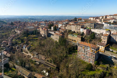 Aerial view of dense historic center of Thiers town in Puy-de-Dome department, Auvergne-Rhone-Alpes region in France. Rooftops of old buildings and narrow streets