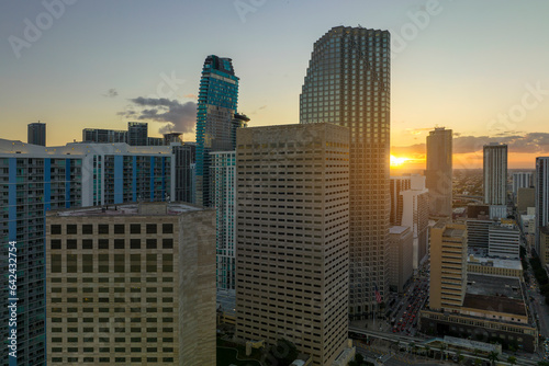 Aerial view of downtown office district of of Miami Brickell in Florida, USA at sunset. High commercial skyscraper buildings and urban traffic in modern american megapolis © bilanol