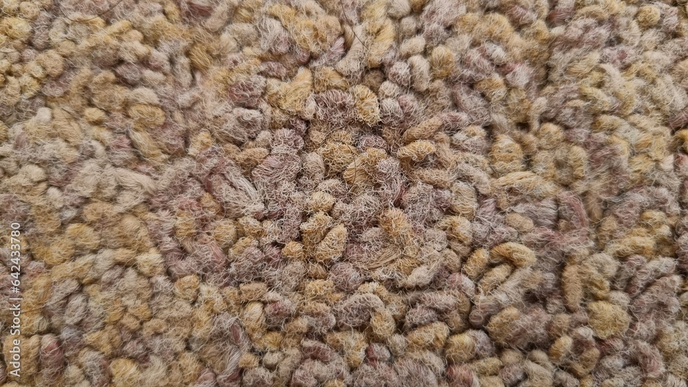 Seamless close up of monochrome brown carpet texture background from above. Brown rug texture. Wall-to-wall carpet loop fabric speckled brown pattern full frame. Seamless close up of monochrome brown carpet texture background from above. Brown rug texture. Wall-to-wall carpet loop fabric speckled brown pattern full frame.