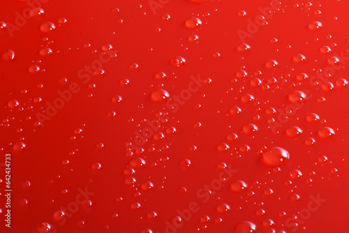 red water drops on a glass background