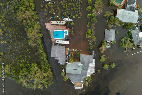 Tela Heavy flood with high water surrounding residential houses after hurricane rainfall in Florida residential area