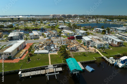 Obraz na plátně Severely damaged houses after hurricane in Florida mobile home residential area