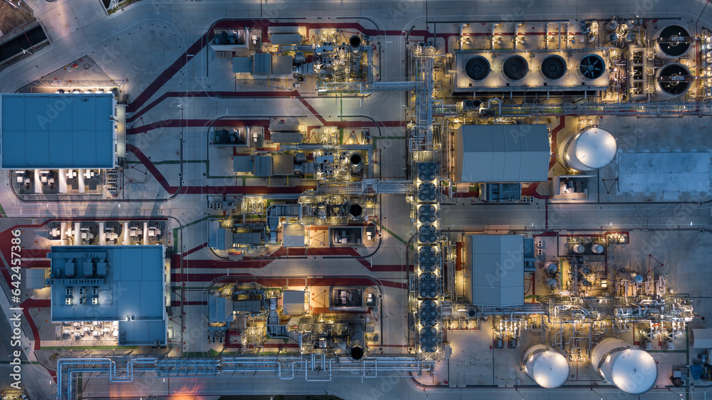 Aerial view power plant for oil refinery petrochemical industrial, Oil  refinery factory power plant at night and pipeline steel, Oil refinery factory and power plant.