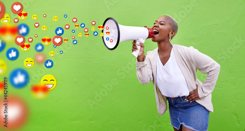 Megaphone, emoji communication and social media with a black woman in studio on a green background. Speech, announcement and a young person shouting into a loud speaker to like, comment or share