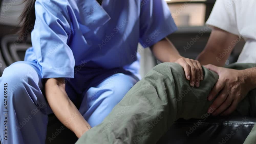 The doctor is diagnosing a man with knee pain and osteoarthritis. Nurse doing leg physiotherapy to patient in hospital. The doctor is diagnosing a man with knee pain and osteoarthritis. Nurse doing leg physiotherapy to patient in hospital.