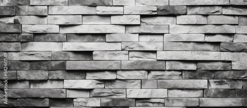 Black and white background with old stone pattern and uneven brick design for interior flooring