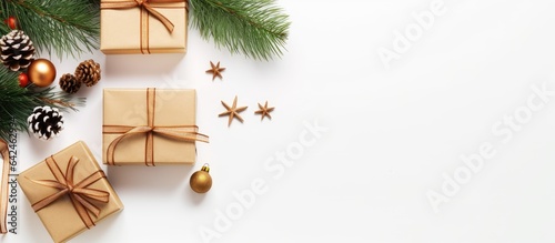 Christmas arrangement Presents ornaments and evergreen branches on blank surface Overhead perspective